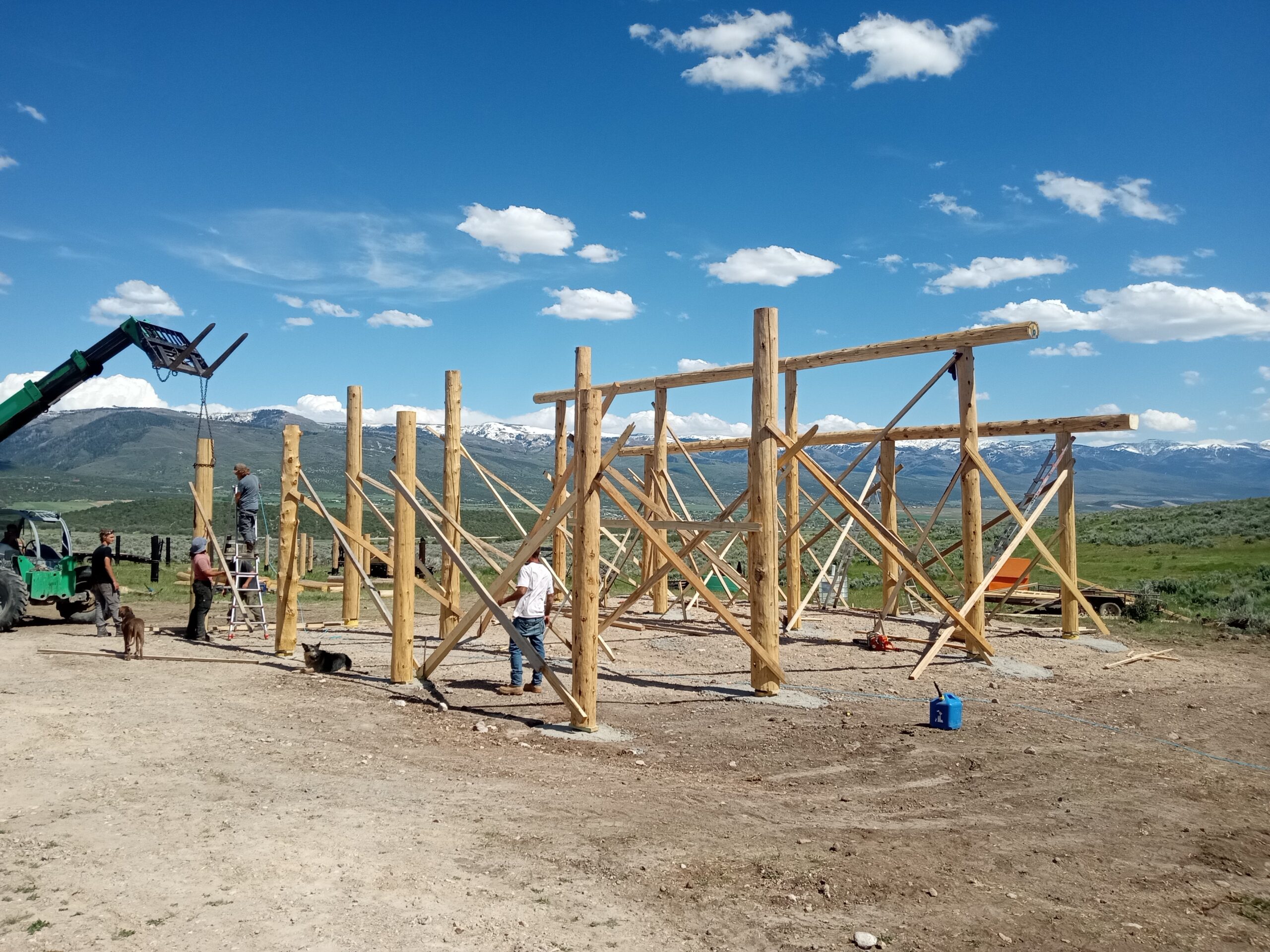Structural timber framing during custom log home construction