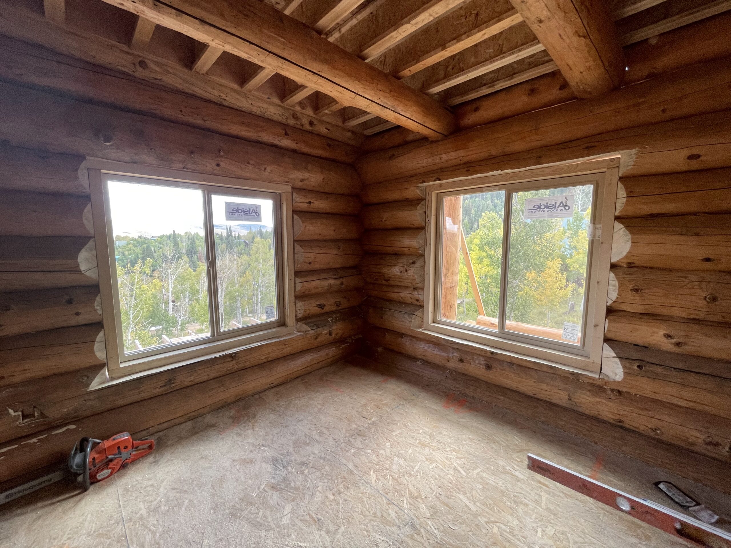 Handcrafted log walls timber beams and joinery inside a Caribou log home