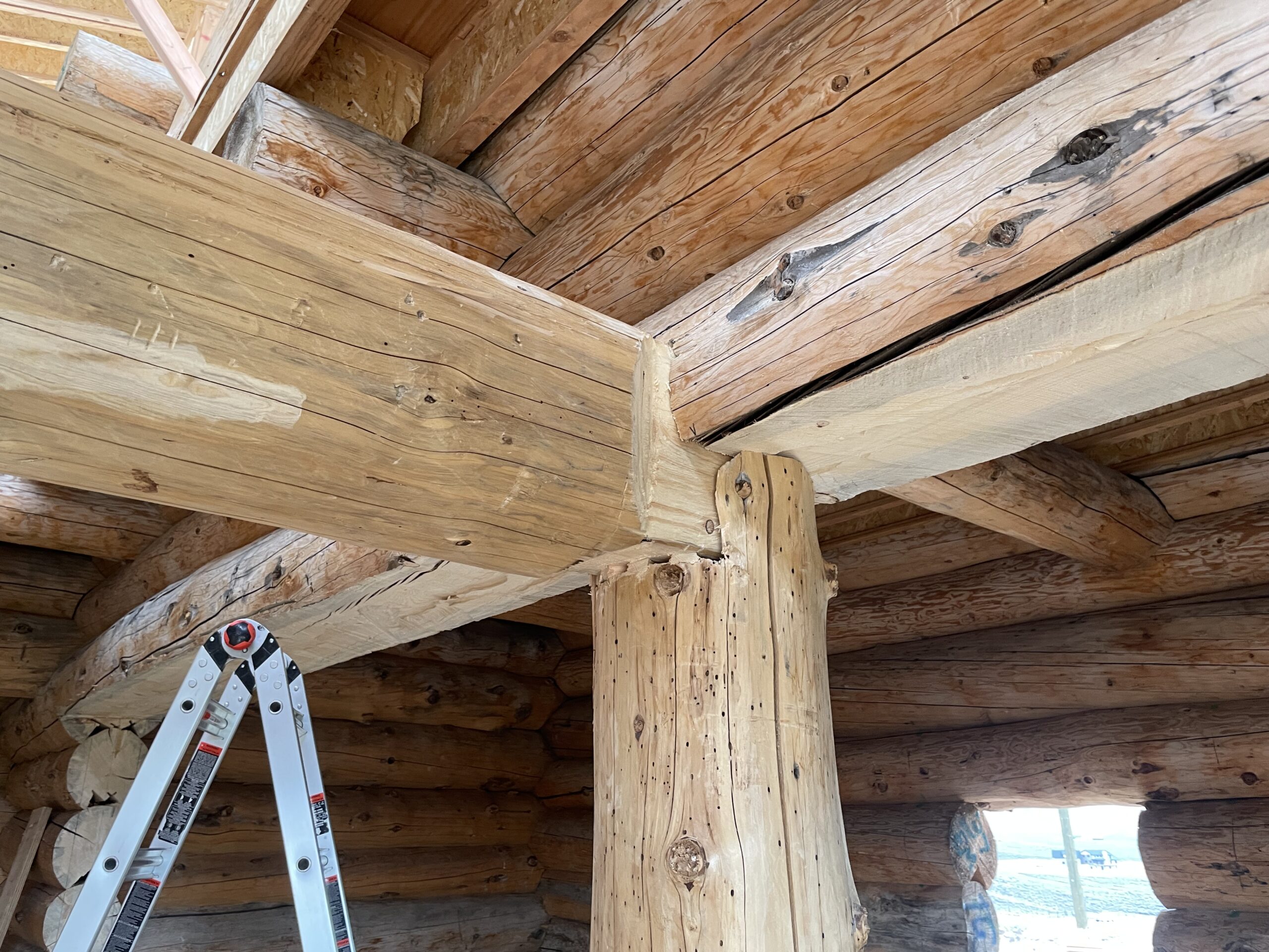 Structural beam and post connection inside the Burton log home