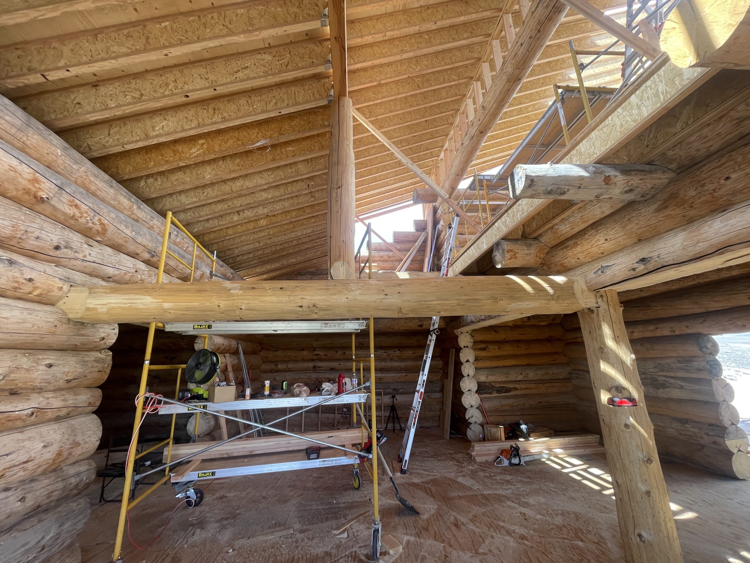 Large structural beam and open interior framing in the Burton log home