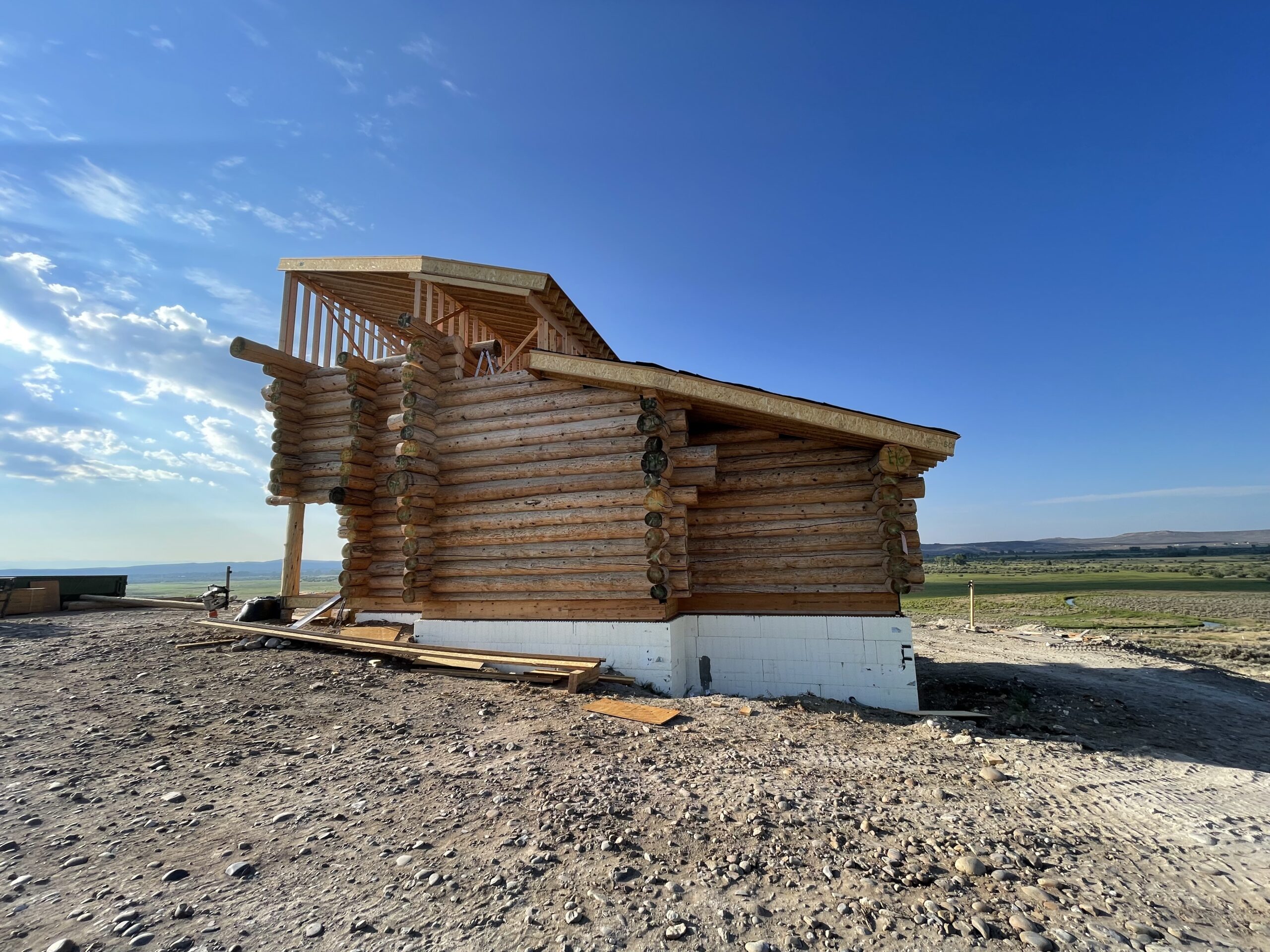 Exterior view of the Burton handcrafted log home during construction