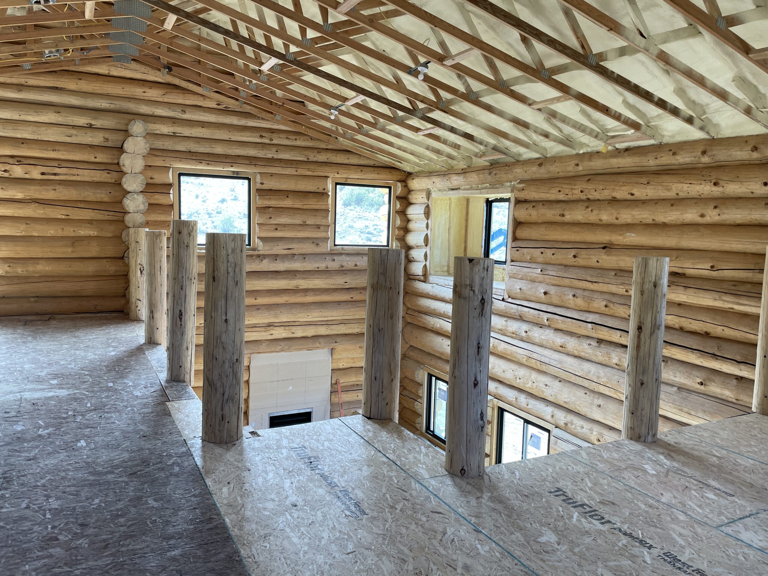 Loft and stair structure inside the Collard's handcrafted log home