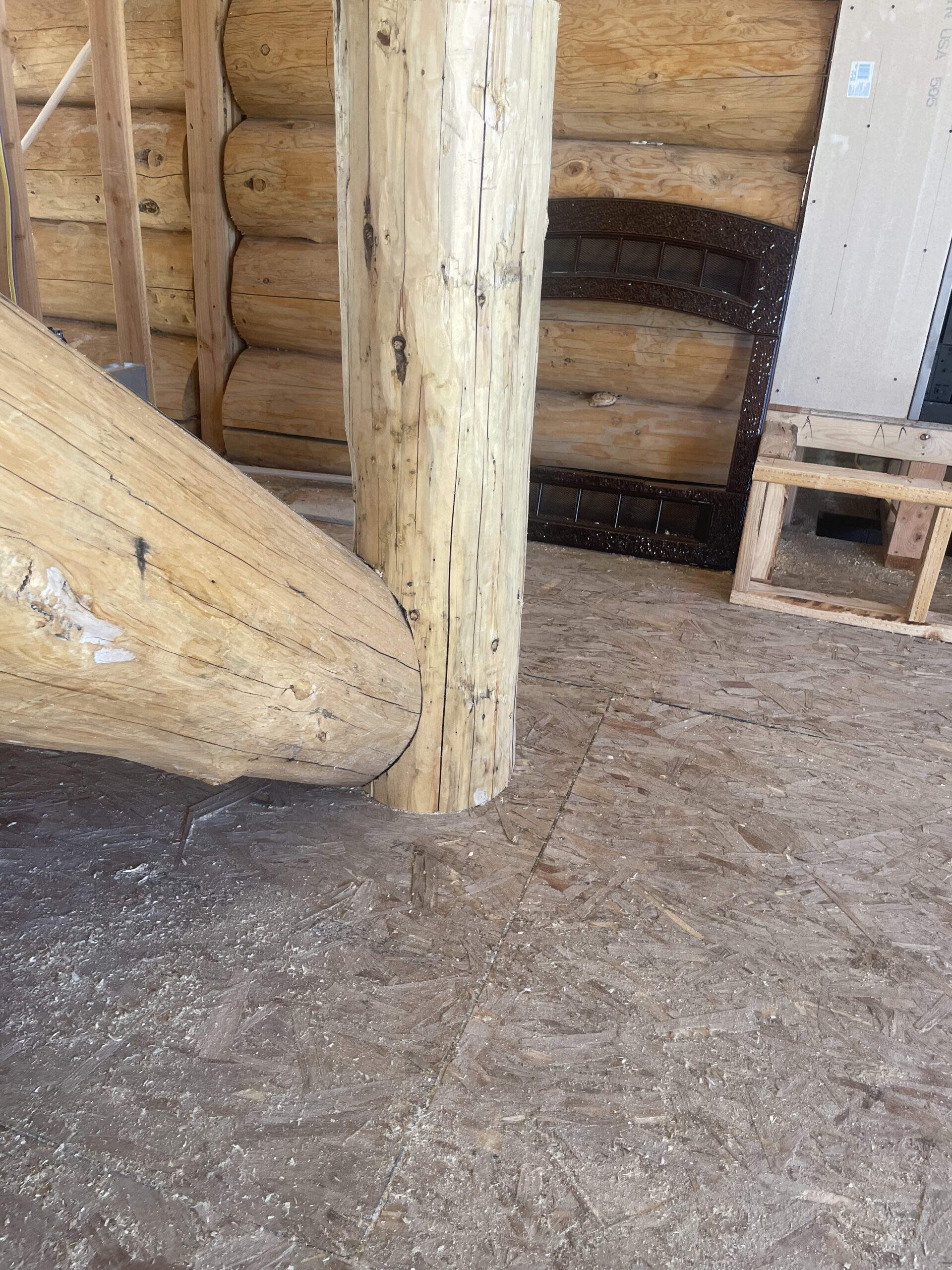 Natural log post and stair construction inside the Collard's home