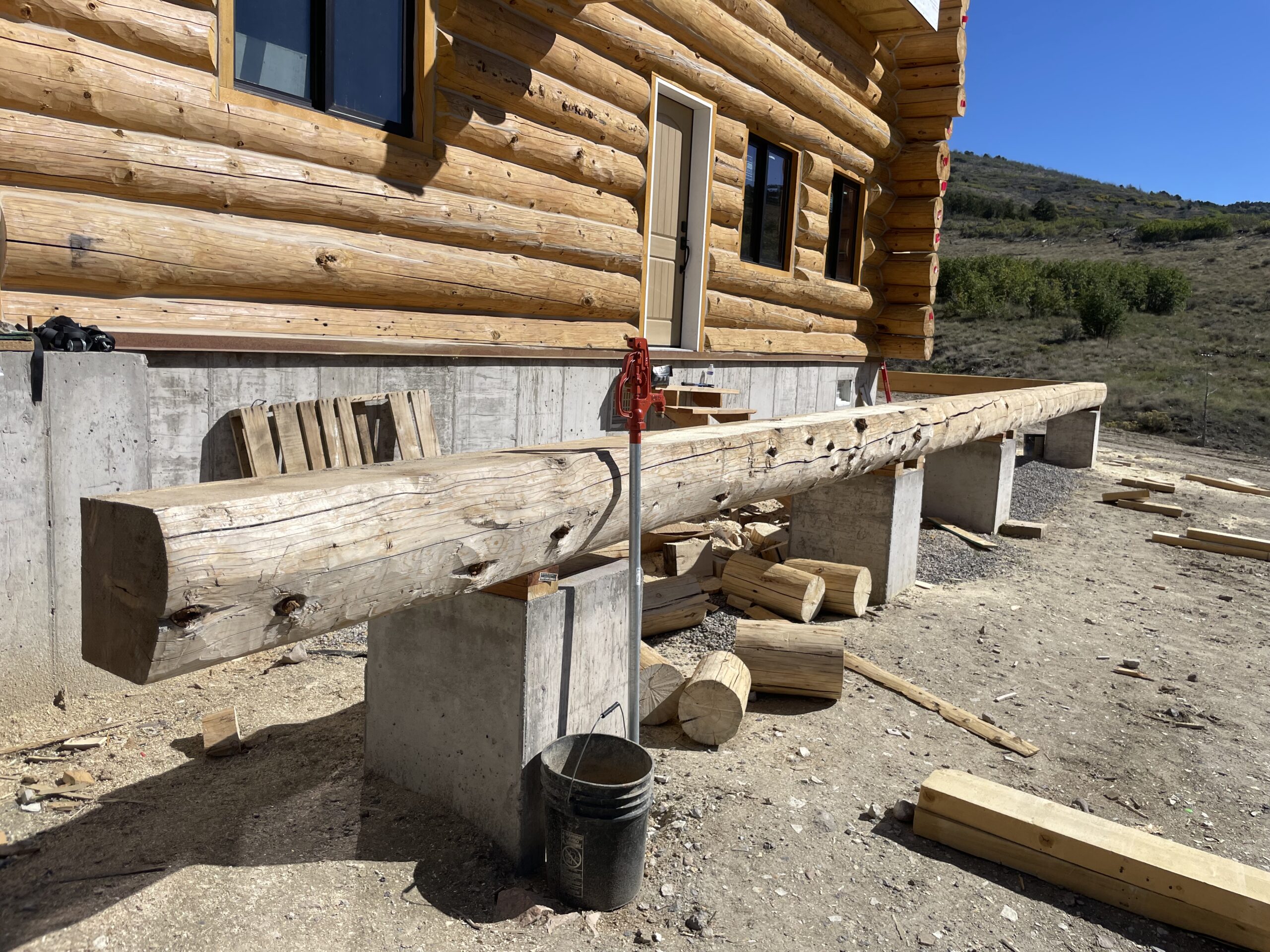 Large log being fitted into the Collard's new-build structure