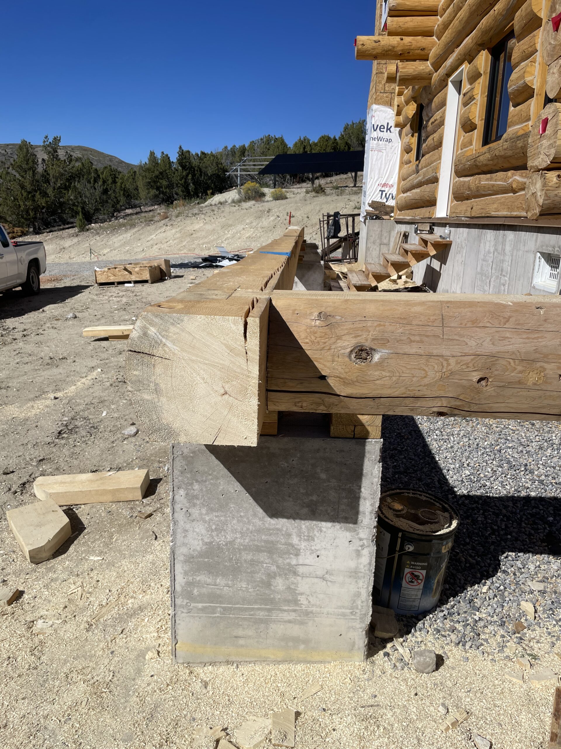 Handcrafted structural log being positioned on the Collard's home